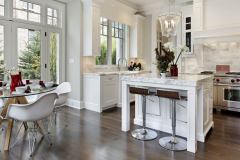 Kitchen in luxury home with white cabinetry.